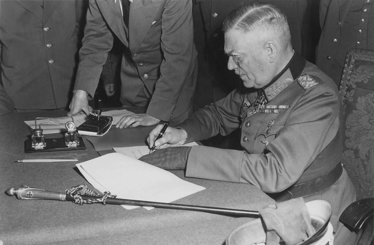 Field_Marshall_Keitel_signs_German_surrender_terms_in_Berlin_8_May_1945_-_Restoration